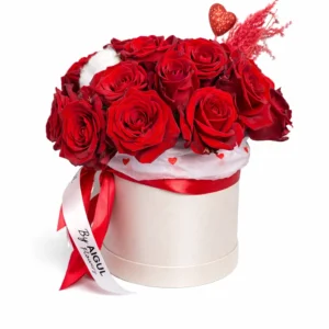 A composition of scarlet roses in a branded box
